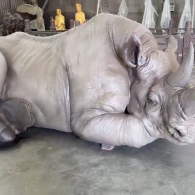 The Resting Rhino – Handcrafted Monumental Solid Brass Sculpture, “The Earth’s Armor,” Life-Size Museum-Quality Wildlife Art